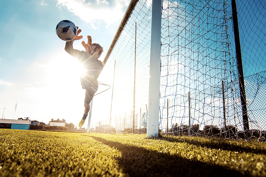 soccer-player-in-action-on-the-soccer-stadium-WEB Soccer Goalie in Action